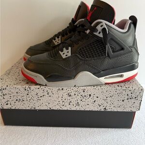 Jordan Men's Black and Gray Sneakers with Red Accents